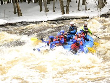 Kosir's Whitewater Rafting on the Peshtigo River in Wisconsin in Spring rafts. White water rafting