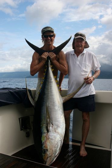 Happy guest with his personal best 80kg yellow fin tuna caught near Moorea