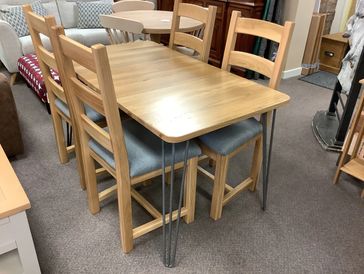 A dining  table with 4 chairs