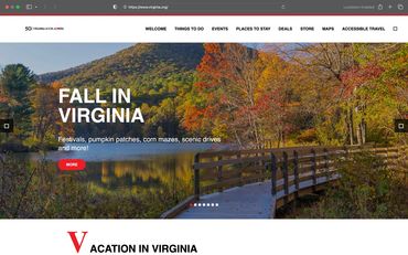 Autumn scenery in Virginia with colorful foliage and a wooden boardwalk by the lake.