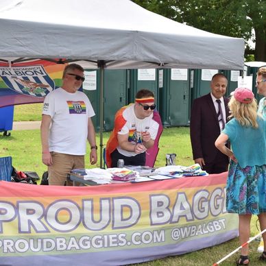 Group of people at Proud Baggies' stall at Sandwell Pride