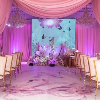 Lights on kent event venue in Brooklyn decorated with gold chandeliers and chairs and pink drapes