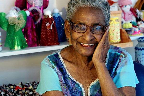 Elder Black woman smiling.