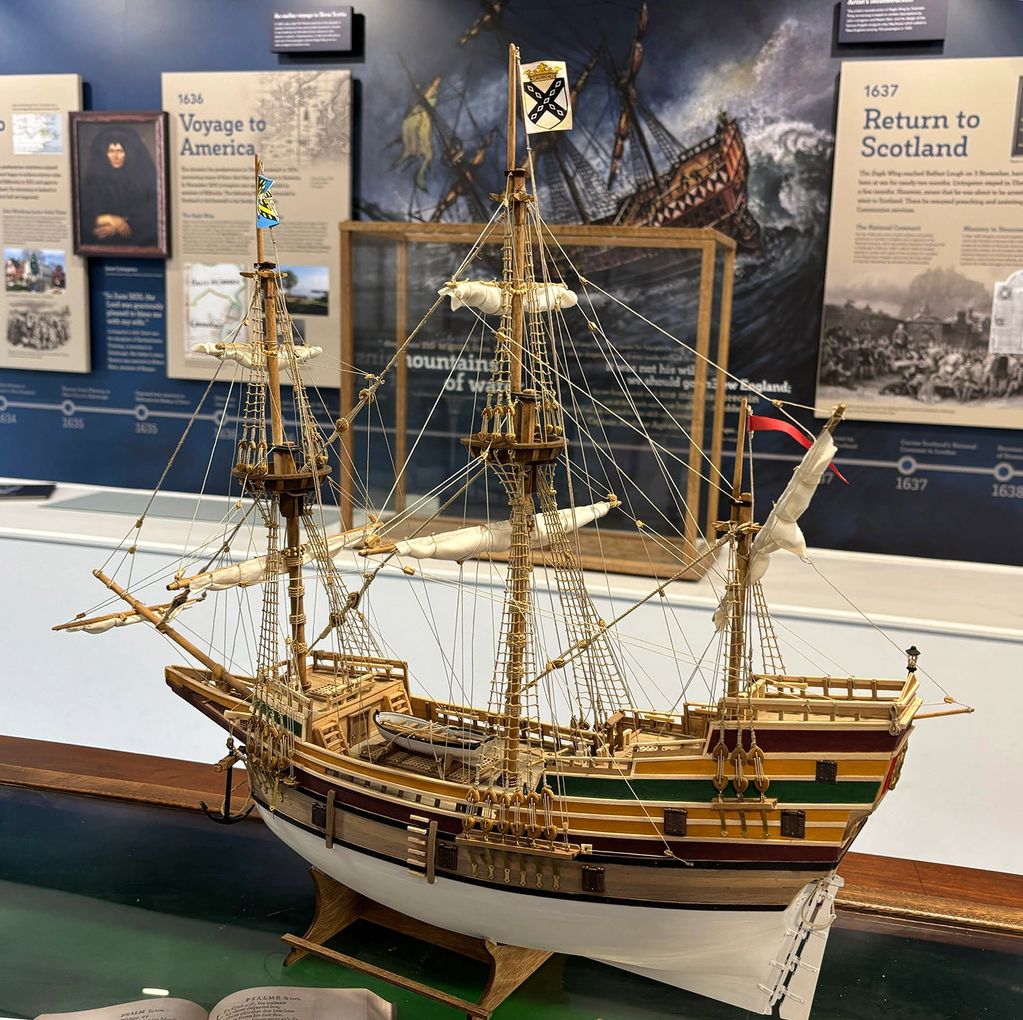 Detailed model of a historic sailing ship in a museum.