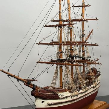 Detailed model of a wooden sailing ship.