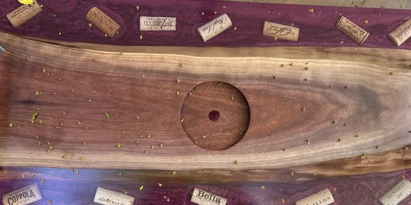 Recessed area in the black walnut for a bottle holder