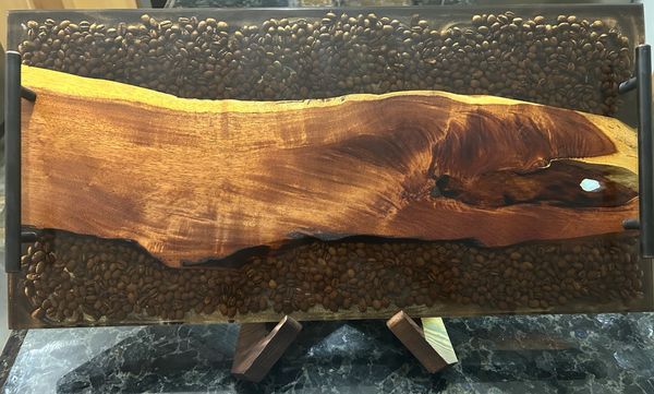 Kiawe wood with embedded coffee beans at the end