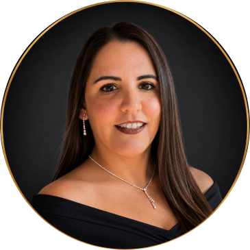 Professional headshot of a woman with long dark hair.