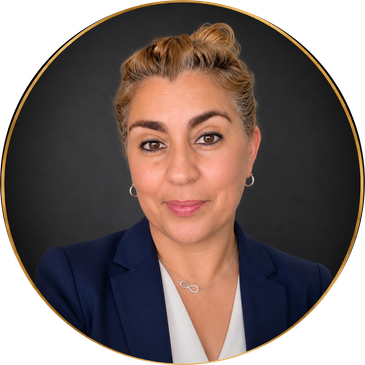 Professional woman with blonde hair in a navy blazer.