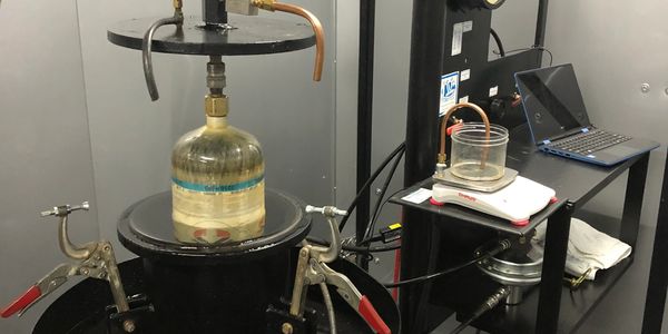 Cylinders are placed into the test chamber and pressurized to DOT regulations.