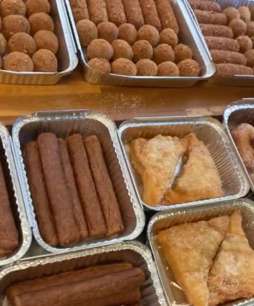 Catering and home delivery. Bitterballen, croquettes, apple foldovers prepared in the food truck.