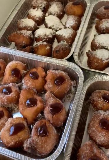 Fresh oliebollen and hot jam donuts. vegan donuts.