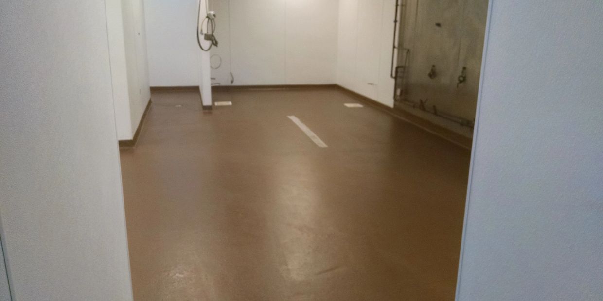 Urethane cement for a commercial kitchen. Super easy to clean and has non-slip texture!!