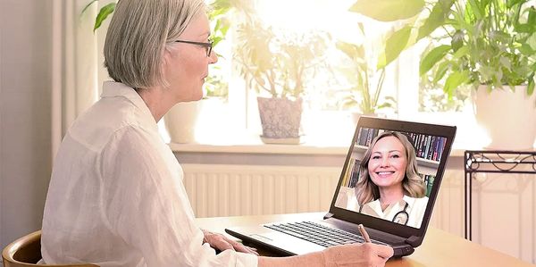 An older woman on a videocall with Dr. Danilychev