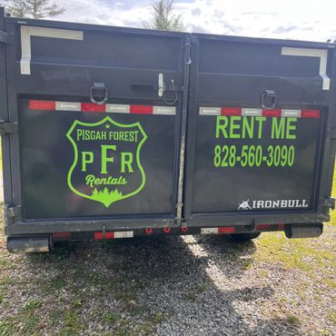 Rear view of dump trailer rental with barn doors in Brevard NC