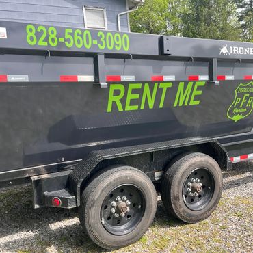 Close up of 10 yard dump trailer rental with Pisgah Forest Dumpsters branding