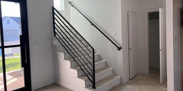 Custom handrails: stair rail and wall rails.