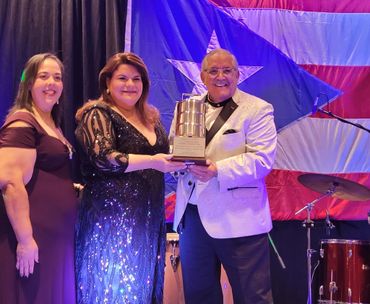 Gov Gonzalez of Puerto Rico accepts the Fiabrera award from Prof Suarez