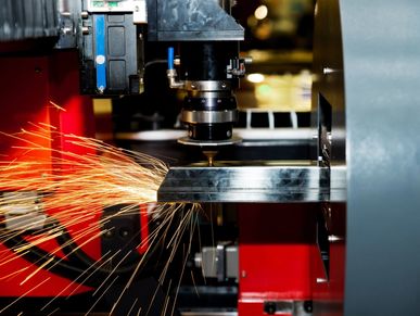 Metal cutting with sparks flying.