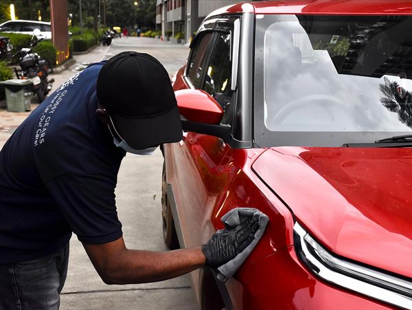 experienced professional cleaning the car