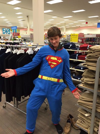 BJ put on a SUPERMAN onesie in Walmart.