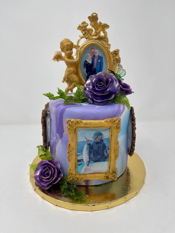 Purple cake with gold frames with photos of people