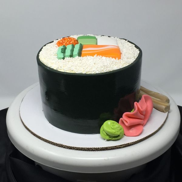 BLack cake with sushi on top