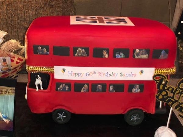 London Bus Cake -red double deck bus with people looking out the windows
