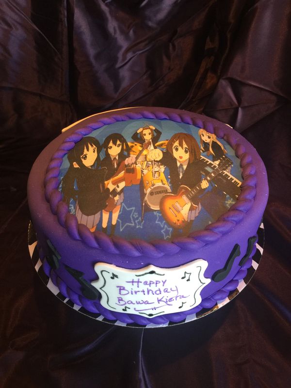 purple cake with Animae band and musical notes