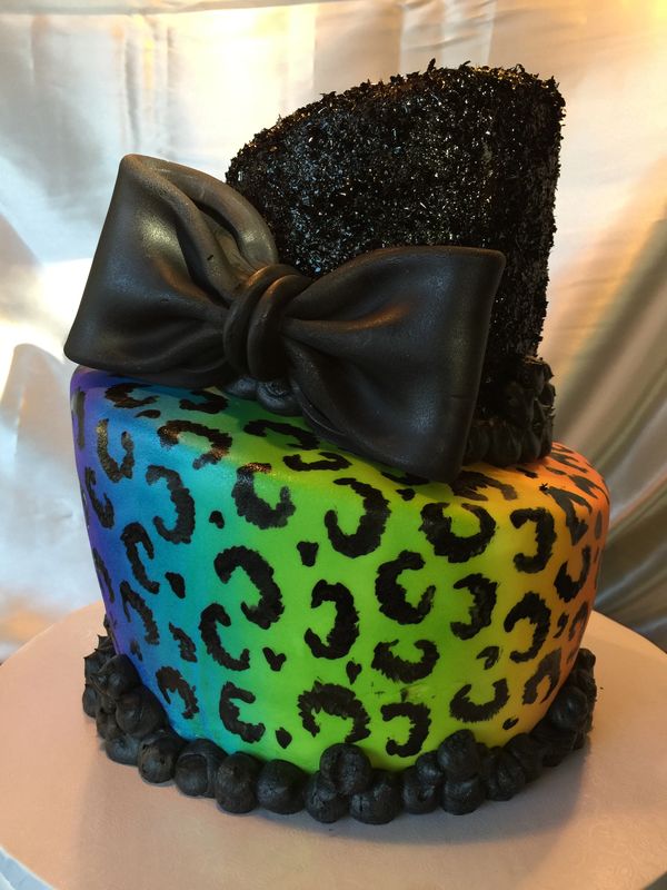 Rainbow topsy turvy leopard cake with black glitter top hat