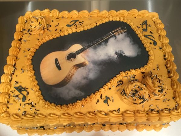 rust cake with guitar edible image on top