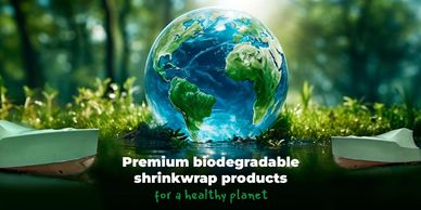 Globe surrounded by greenery with biodegradable shrinkwrap products promoting eco-friendly solutions.