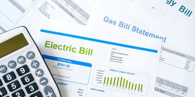 Electric Bill and a calculator on a table 