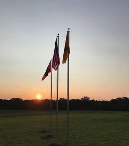 Beautiful sunset with our residential flagpoles