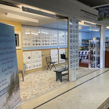 Jewelry stand featuring handmade magnetic necklaces and earrings.