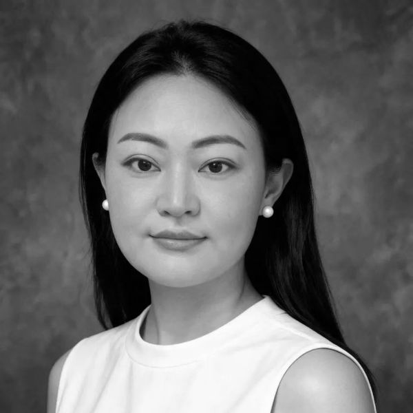 Black and white portrait of a woman with pearl earrings.
