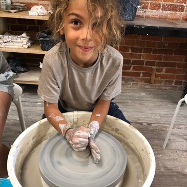 Children learning on the Pottery Wheel Saint Louis
