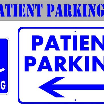 Patient parking signs with arrows directing left.