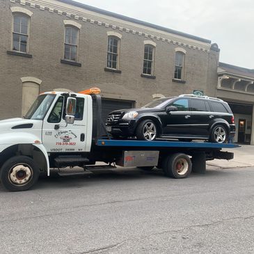 Luxury cars towing 