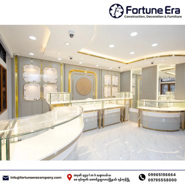 Modern, elegant jewelry display showroom with bright lighting and glass cases.
