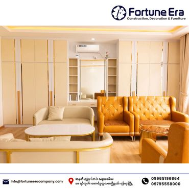 Modern living room with beige and orange leather sofas and elegant cabinetry.