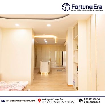Modern, minimalist bedroom with wooden floors and built-in storage.