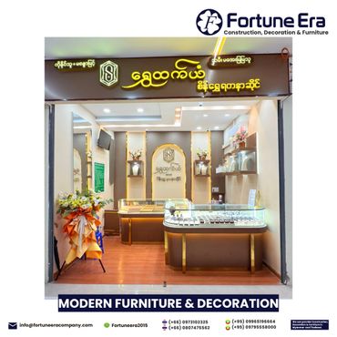 A modern jewelry store interior with elegant display cases and floral decorations.