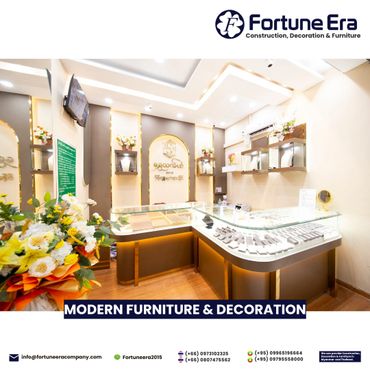 Modern jewelry store interior with elegant display cases and floral decorations.