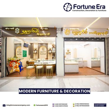 Modern furniture and decoration showroom with elegant gold accents and bright lighting.