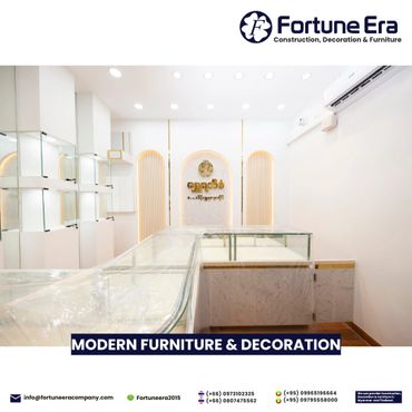 Bright, modern showroom with elegant glass display counters and warm lighting accents.