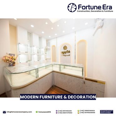 Modern, sleek furniture and decoration in a bright showroom with glass display cases.