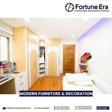 Modern bedroom with wooden flooring and stylish furniture.