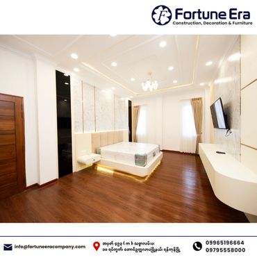 Modern and elegant bedroom with wooden flooring and ambient lighting.