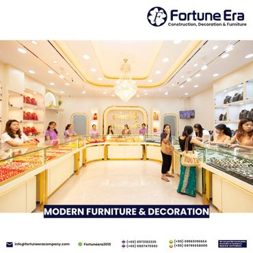 Bright, modern jewelry store interior with glass display cases and staff.